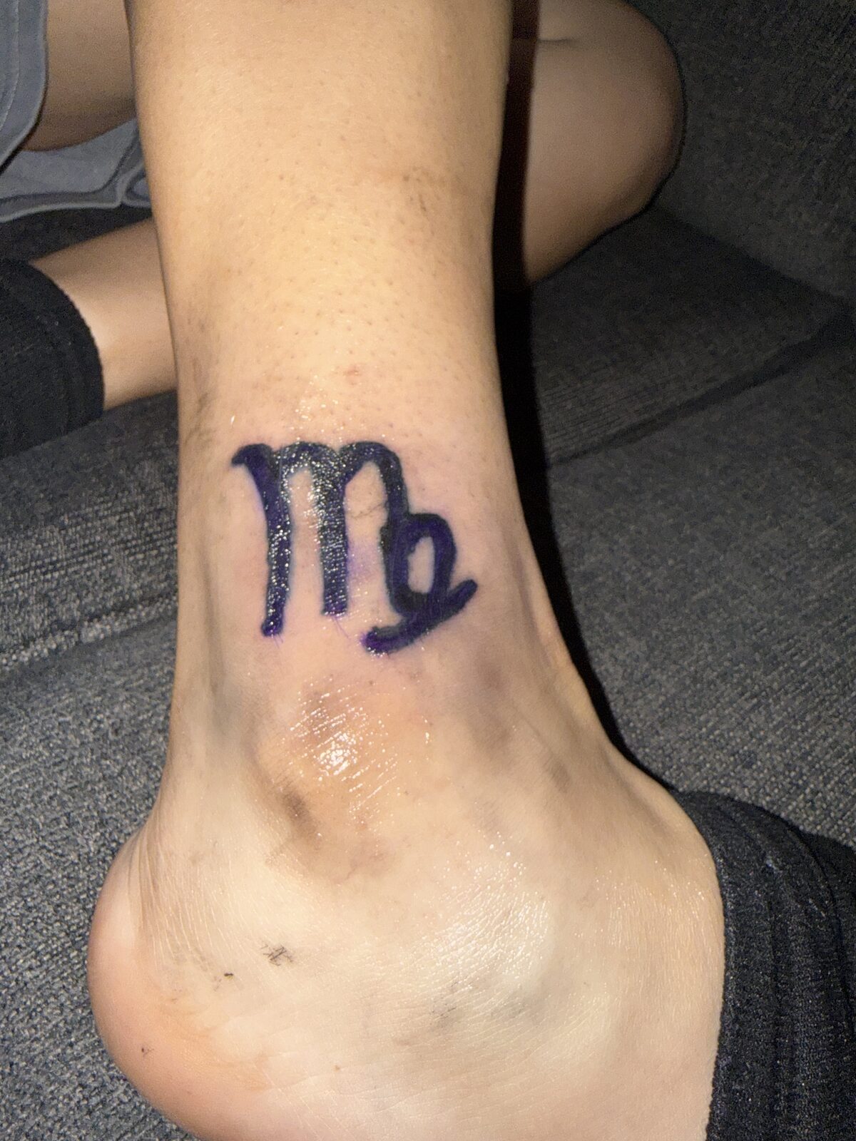 Zodiac symbol tattoo on the ankle by Yaa Z Studios
